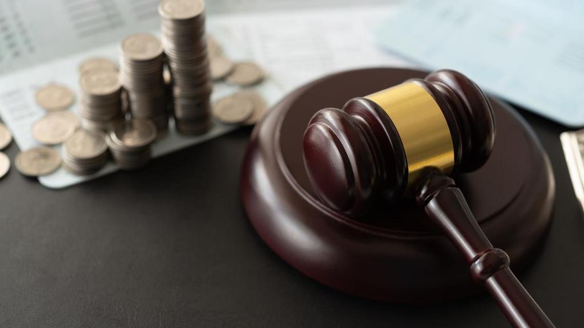 gavel judge with coin money and book bank accounts. banking money finance law.